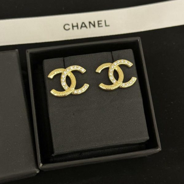 Boucles d'oreilles Chanel moitié diamant moitié cc