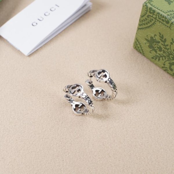 Boucles d'oreilles creuses entrelacées double g Gucci