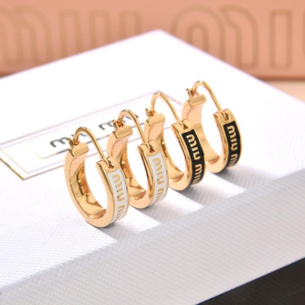 Boucles d'oreilles pendantes huile Miu Miu