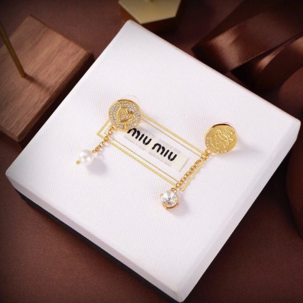 Boucles d'oreilles clous asymétriques Miu Miu