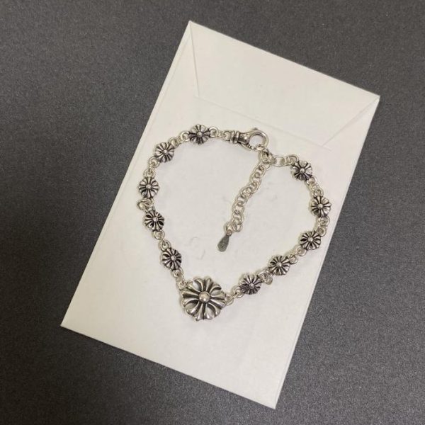 Bracelet croix coeurs chromés