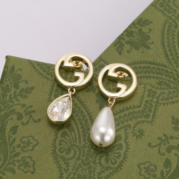 Boucles d'oreilles clous asymétriques Gucci (ABB0)