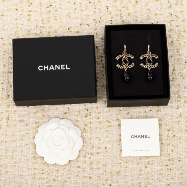Boucles d'oreilles pendantes double C en cuir Chanel