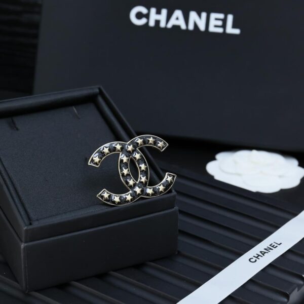 Broche étoile Chanel (F64D)