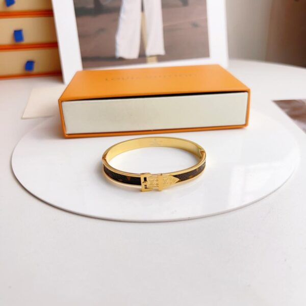 Bracelet en métal cousu presbytie vintage Louis Vuitton (8645)