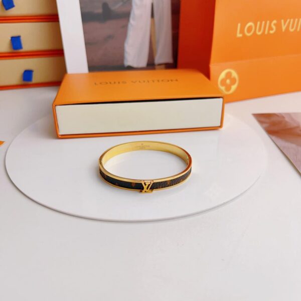Bracelet en métal cousu presbytie vintage Louis Vuitton (F71F)